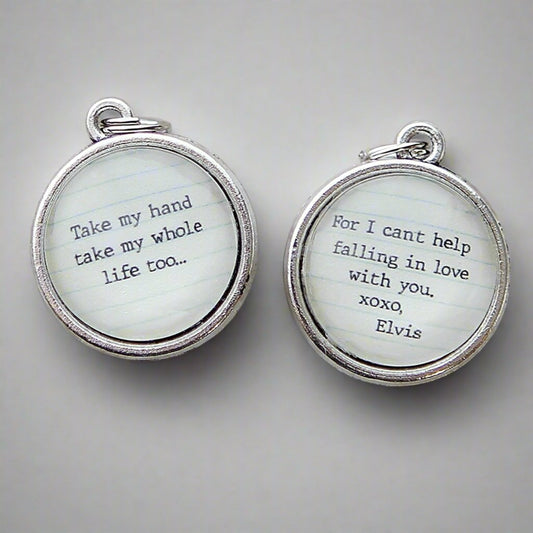 two sided round jewelry charm with Can't Help Falling In Love Lyrics on it