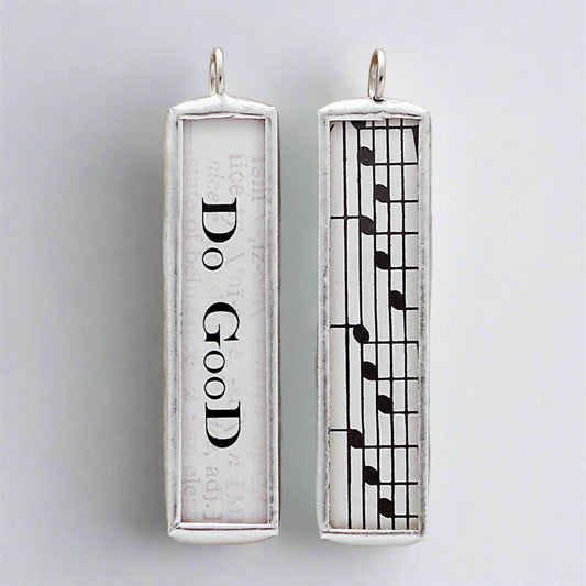 Soldered charm that says Do Good