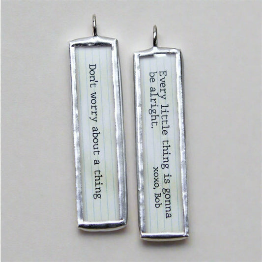 two sided jewelry charm that says Don't Worry About A thing