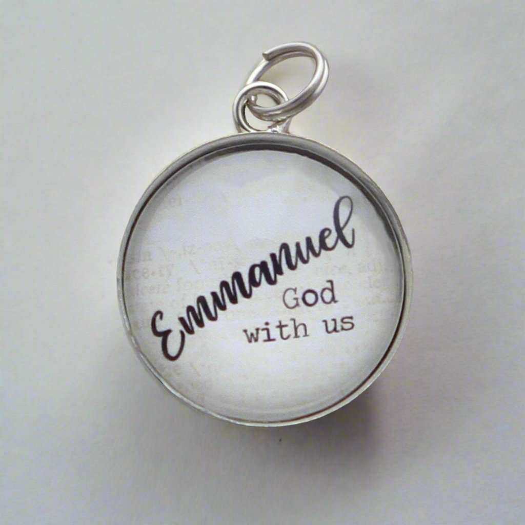 Round jewelry charm that says Emmanuel God with us