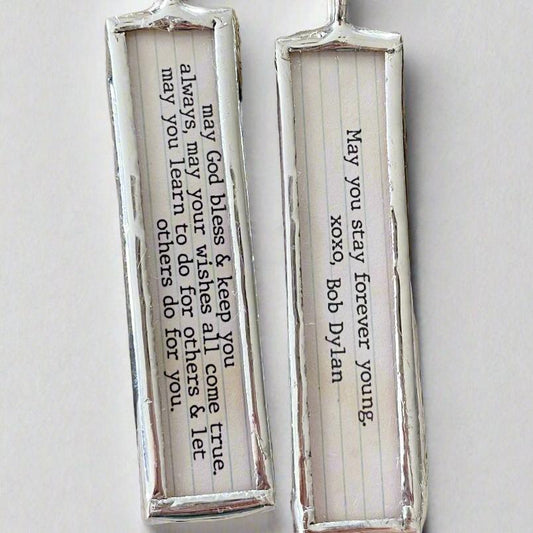 two sided soldered charm that says Forever Young