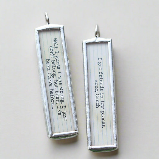 two sided jewelry charm that says Friends In Low Places