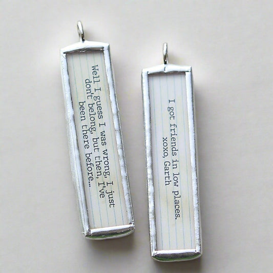 two sided soldered charm that says Friends In Low Places