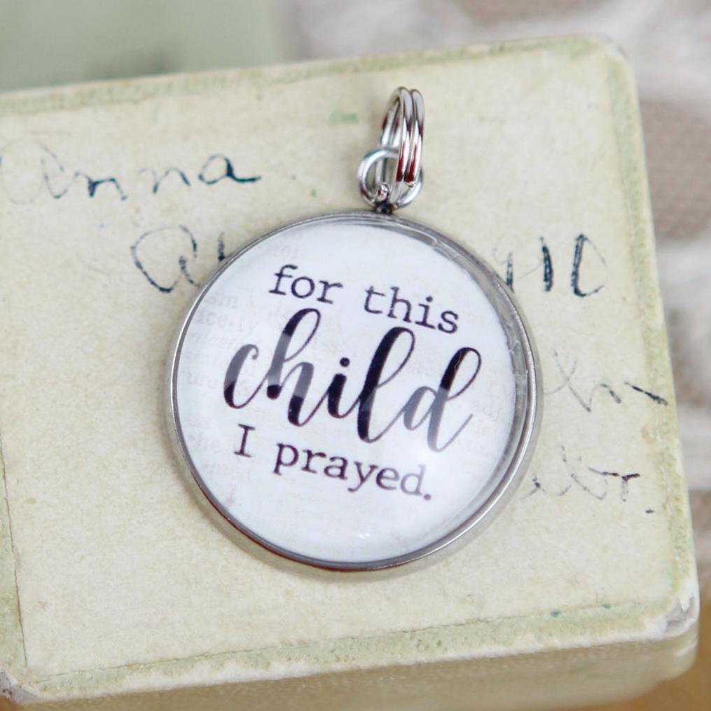 round jewelry charm that says For This Child I Prayed