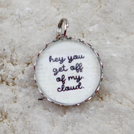 round jewelry charm that says Get Off Of My Cloud