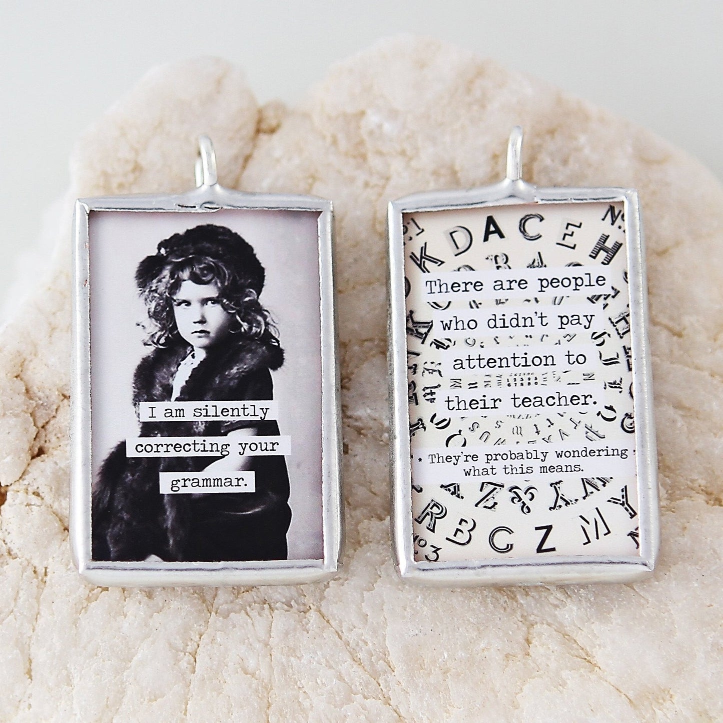 two sided jewelry charm with a grammar correction quote on it