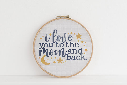 Embroidery hoop with 'I love you to the moon and back' text on a white background