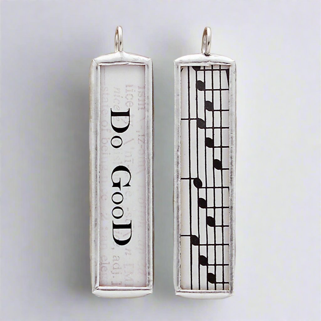 Soldered charm that says Do Good