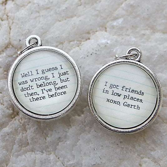 round jewelry charm that says Friends In Low Places